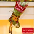 Green Christmas stocking with long-legged reindeer plush hanging on white fireplace - Reindeer Style (081-C)