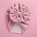 Close-up of baby pink turban hat with a large soft decorative bow for infants - 18*21cm / Pink
