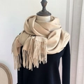 Elegant camel faux cashmere scarf with fringes on a model for winter warmth - Oatmeal
