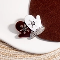 Macro detail of Christmas glove brooches with silver snowflakes and white rhinestones - Christmas Gloves (Brown + White)