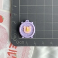Close-up of a 2.5cm cartoon alarm clock resin accessory for DIY crafts on a scale ruler - Alarm Clock