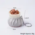Realistic steamed shumai food keychain model with size markers and silver metal ring - Shumai-Keychain