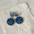 Detail view of double layer round drop earrings with navy blue zircon stones in silver finish - Silver Base Dark Blue Rhinestone