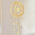 Golden sun catcher with natural crystal stones and prisms reflecting rainbows - Citrine