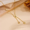 Detail of gold number 5 pendant with white inlay and crystal on floral chain - Rose Number 5 Double Layer Necklace / Gold