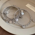 Detail view of silver multi-layer coin pendant bracelet on a minimalist ceramic plate - 21# Coin Pendant Style (HB4515)