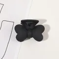 Macro shot of matte black butterfly hair claw clip with frosted texture finish - 4cm Butterfly-Black