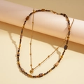 Detail of 18k gold plated double layer necklace with tiger eye beads and golden pendant - 2-Piece Set Brown Tiger's Eye (18K Gold Plated)