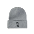 Detail of grey beanie showing dense knit texture and I'M COLD embroidery in black - Gray