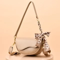 Chic beige saddle crossbody bag with chess pattern silk scarf and gold hardware - Khaki