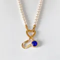 Exquisite pearl chain necklace featuring 14K gold letter A and blue crystal pendant - Letter U