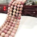 Natural pink purple round stone beads with unique mineral texture on white plate - Redwood Grain Stone 22 / 6mm / Approx 63pcs
