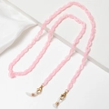 Dettaglio catena per occhiali in acrilico rosa con chiusure dorate e anelli in silicone - Rosa Chiaro