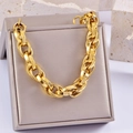 Detail of chunky gold chain bracelet with large oval links on a display stone - Style 1-Oval Chunky Link