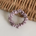 Elegant bean paste pink satin scrunchie with silky texture on a woven wooden mat - Dusty Pink
