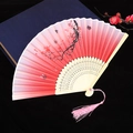 Pink gradient folding fan with plum blossom pattern, bamboo ribs, and matching tassel - Size 58