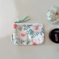 Detailed top view of floral cotton zipper pouch with pink peonies and green cord pull - Pink Large Flowers