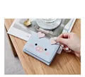 Detail of light blue tri-fold wallet with cute cartoon pig ears and heart-shaped accent - Pigs Style / Pig Blue