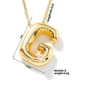 Detailed view of golden bubble letter G pendant with star zircon and dimensional texture - Letter G Style (N01069-G)