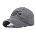 Detail view of the embroidered One Moment text on this vintage washed grey baseball cap - Adjustable / Gray
