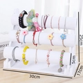 Présentoir à bijoux blanc à trois niveaux pour bracelets et montres, taille 30x17x25cm - Présentoir À Bracelets À Trois Rangées En Velours Blanc