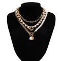 Detail of multilayer gold chain and baroque pearl necklace set on a black neck model - Multi-Layer Snake Pearl OT Buckle Combo Style