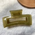 Close-up of olive green jelly hair claw clip with a sleek rectangular resin structure - Jelly Green
