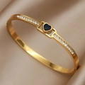 Polished gold titanium steel cuff bracelet with blue heart gem and zircon side inlay - Black Heart with Pavé Stones