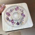 Close-up of irregular amethyst beads and faceted crystals on an elegant beaded bracelet - Amethyst Glass Crystal