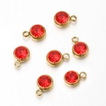 Set of seven red birthstone charms with gold plated stainless steel bezels for DIY jewelry - Gold Base Red