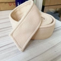 Close-up of beige wool coat belt showing reinforced stitching and soft brushed texture - Apricot