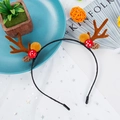 Brown reindeer antler headband with red mushroom and pine cone on festive background - Style 33 Brown Antler Mushroom