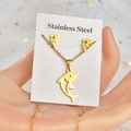 Detailed view of dolphin pendant necklace and earrings set in golden stainless steel - TT-131 Dolphin