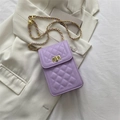 Quilted lavender crossbody bag with gold chain strap and spherical buckle detail - Purple