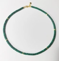 Detail of natural green malachite beaded necklace with gold spacers and heart pendant - Malachite Green Texture