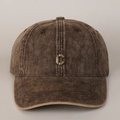 Detail of metal C letter emblem on vintage washed cotton baseball cap in dark brown - Camel