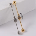 Industrial barbell piercing in gold and silver finish with triple 9.5mm clear zircon stones - NO 5 3-Stone Cluster