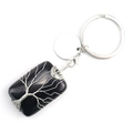 Détail du porte-clés arbre de vie en pierre noire enveloppé de fils métalliques argentés - Obsidienne