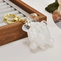 Turtle keychain with transparent shell and sparkling white liquid glitter balls - Luminous White