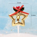 Golden star Christmas cake topper with red bow, holly leaves, and small bell decor - Gold Grid Pattern Pentagram Style