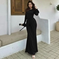 Close-up of elegant black maxi dress featuring waist knot detail and ruffled cuffs - S / Black