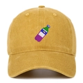 Detail of vintage washed yellow baseball cap showing fine bottle embroidery texture - Yellow