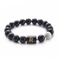 Black agate and white turquoise beaded bracelet featuring a gold letter R charm - Letter R