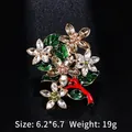 Champagne crystal flower brooch with green enamel leaves on a gold alloy base - BR3046 Floral Pin