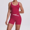 Detail of red sports top with U-neck and high waist shorts featuring white cross waist design - Carmine