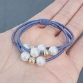 Three-strand elastic hair tie in navy blue with white faux pearls and gold beads - Denim Blue