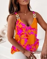 Detail of V-neck summer tank top with gold chain straps and floral print on light fabric - S / Orange Purple Floral