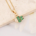 Macro view of golden swan pendant featuring emerald zircon wings and pave crystal details - Swan Style (12#)