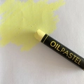 Single yellow heavy oil pastel with thick texture and vibrant color stroke on white paper - Lemon
