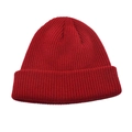 Close-up of red knit beanie showing thick ribbed texture and wide cuffed brim for winter - Burgundy